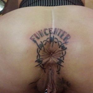Crazy tattoo on her asshole