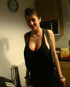 big brunette breasts in a black wife-beater