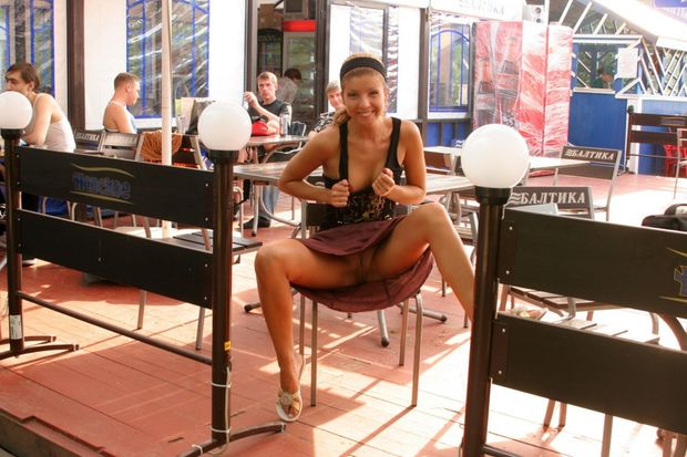 Happy girl flashing in public
