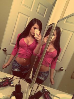 Pretty brunette with big fake tits