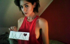 big brunette teen side breasts peeking out from red top