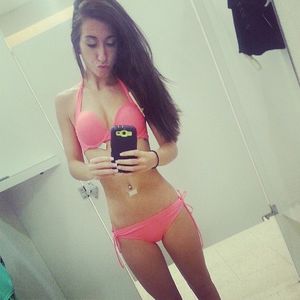 SKinny brunette trying on a new Bikini
