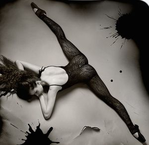 fine brunette ass doing the splits in black lace leotard