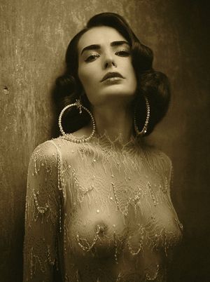 Vintage round brunette tits in white lace shirt