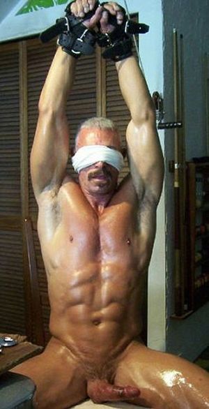 older blond guy in bondage.