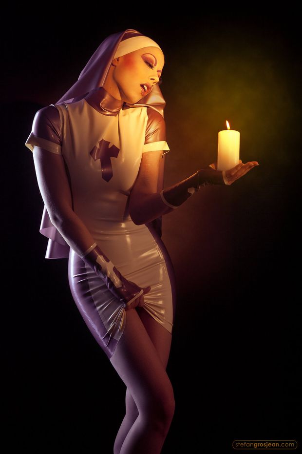 Nun holding a Candle
