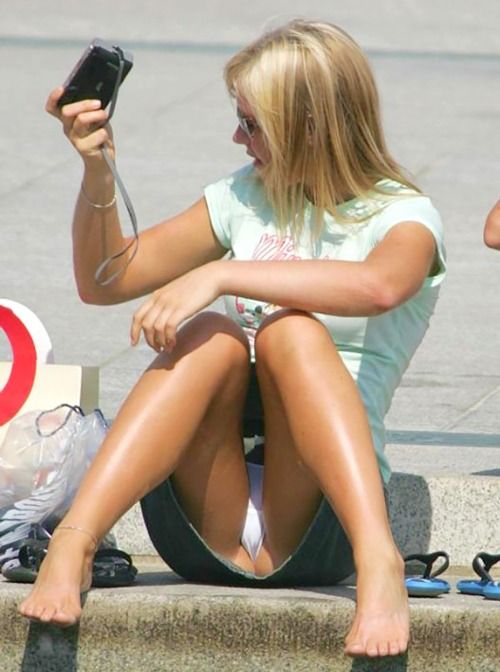 Classic upskirt of blond on sidewalk