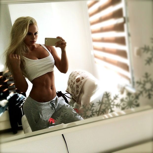 Anna Nystrom stripping down afte a sweaty workout.