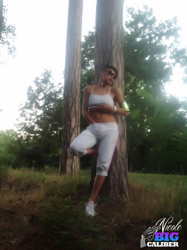 TS Nicole Big Caliber flashing her phallus in the woods