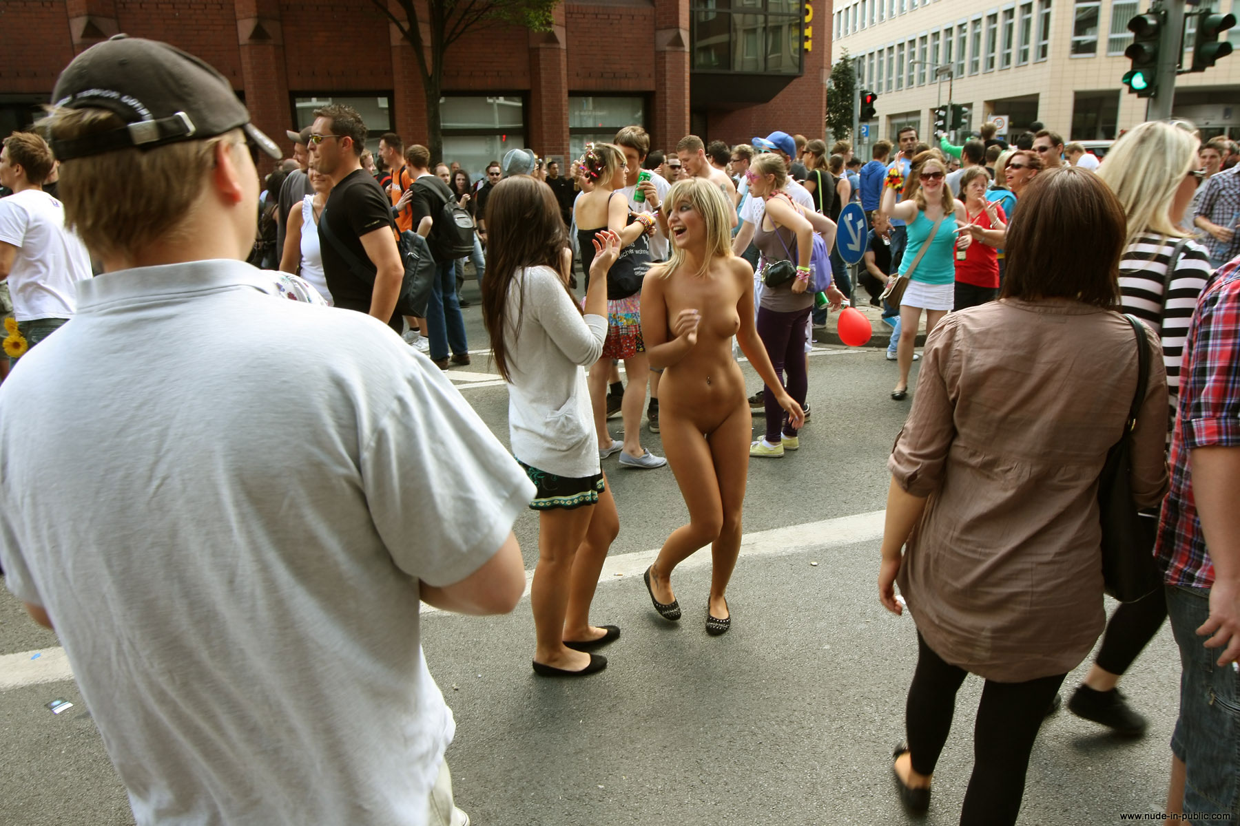 Naked in the middle of a crowded street.