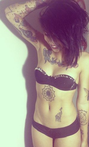 tattoos with a heart-shaped nip slip
