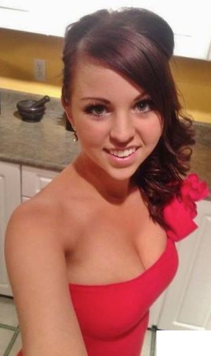 Pretty brunette in red dress going to a ball