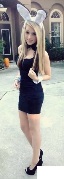 Thin blonde 18yo teen in black tight dress, heels and bunny ears