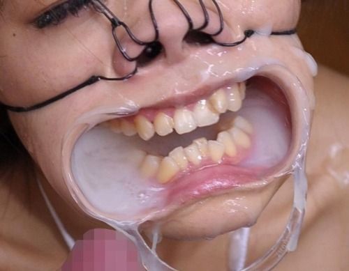 What a fantasy!  Mouth hellishly held open and filled with so much cum that the poor slut can’t even swallow.  It’s a shame the men filling her couldn’t get more up those hooked nostrils.