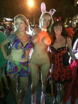 She's naked at a costume party.