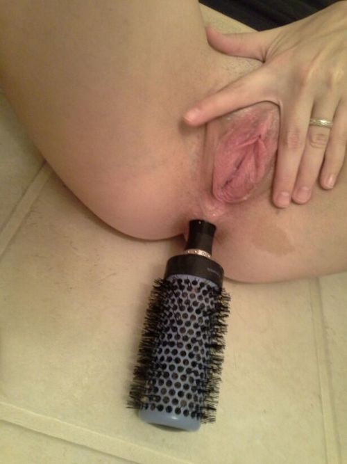 Big hairbrush in a tight asshole