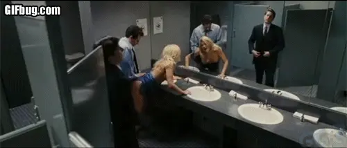 Standing doggystyle in office restroom