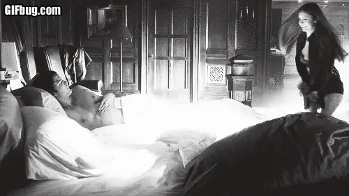 Girlfriend jumping into bed