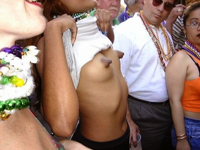 Innocent girl psing nude in public showing her big and hard nipples