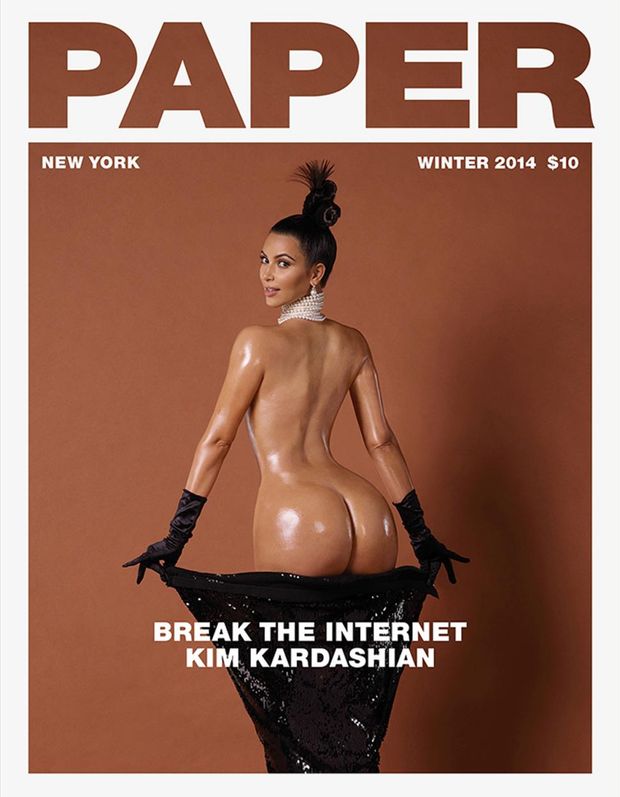 Kim Kardashian shared a photo of herself naked on the cover of Paper magazine Tuesday.