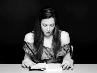 Stoya reading with a vibrator