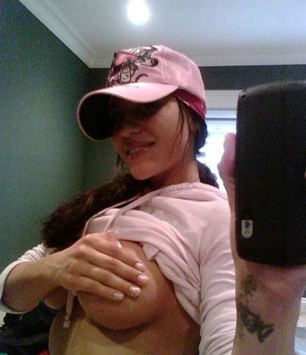 Rate This Sexy Girl Wearing A Baseball Cap Holding Her Tits