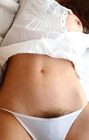 Dusky maiden flashing her pubes.