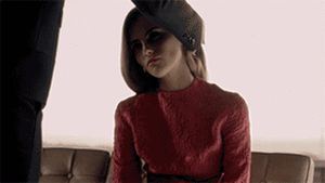 kneeling before her Master