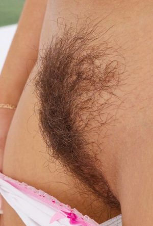 Candy showing her hairy pussy.