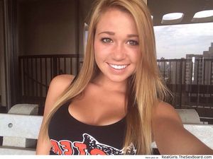 Hooters girl with a smile so bright, it could light up a room
