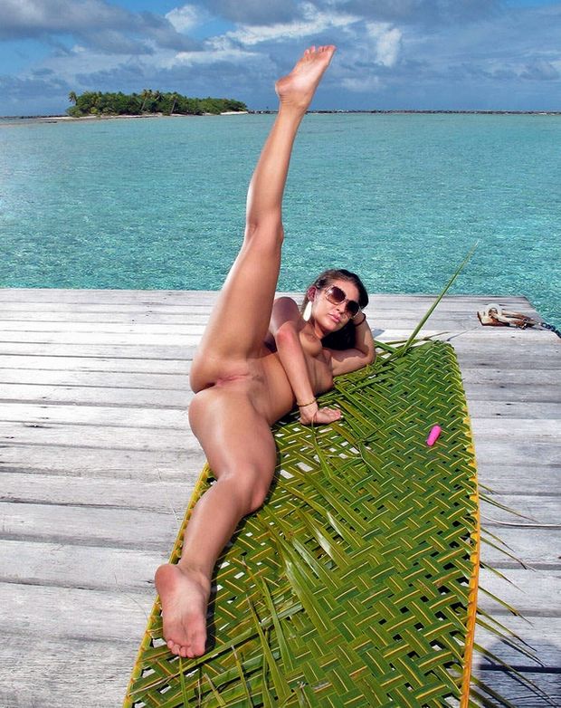 With her legs wide open at the beach