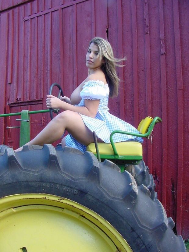 Blonde riding tractor in Dorothy outfit and tits out