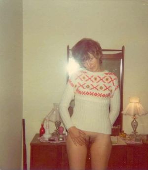70s women in sweater..