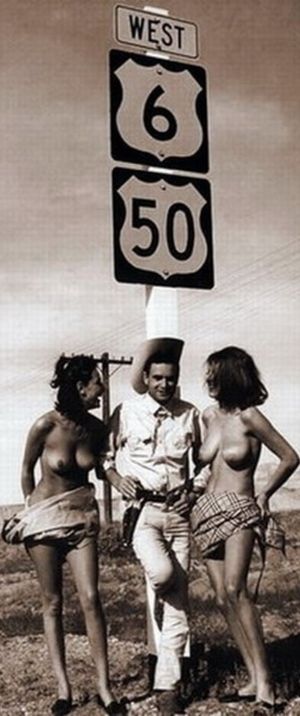 Vintage cowboy on hwy with two nude women