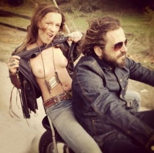 Biker chick flashing her tits for camera