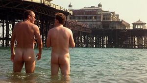 John and Eddie show butt and back balls while discussing business. Towards the end of the scene, there’s a quick and distant glimpse of Eddi