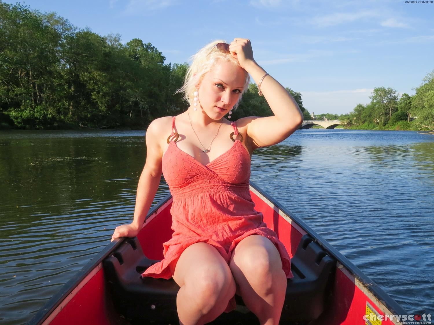 Cherry Scott striptease in a canoe