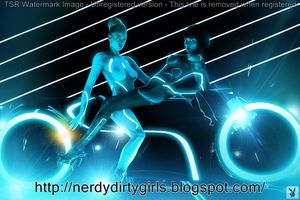 Two Tron Cosplayers Topless on a Light Cycle