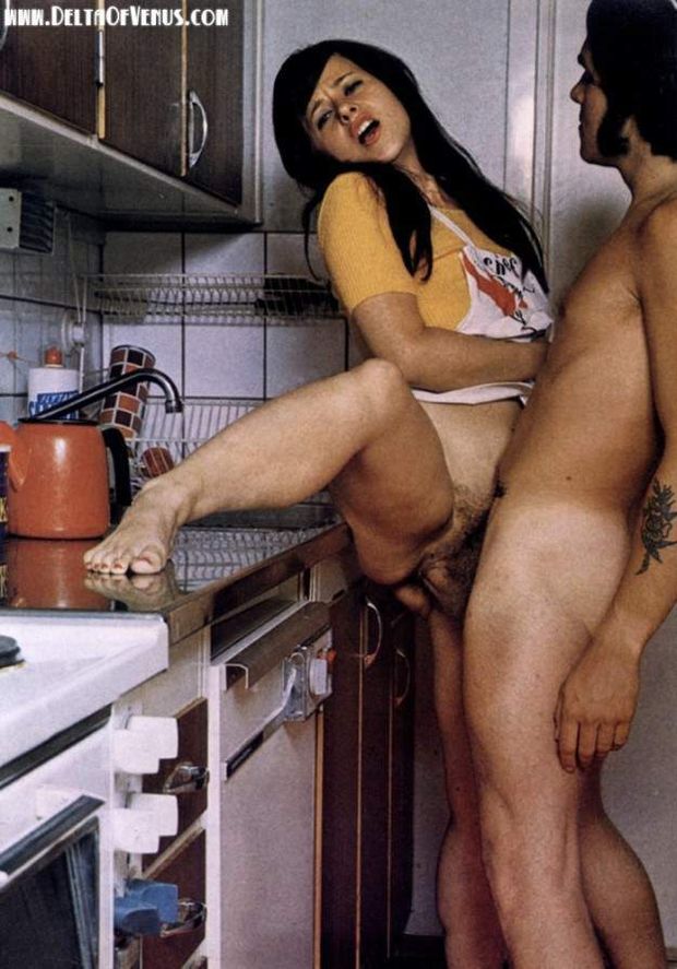 Chef’s apron pulled side, toes curled on stainless-steel countertop, pre-dinner penetration. One of several shots from a retro sex mag pictoral, 1970s California.