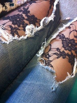 black lace through ripped jeans