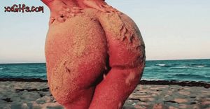 Sexy Babe Spreading Sand In Her Ass At Beach