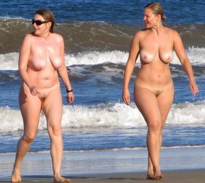Two big tit ladies walking on beach
