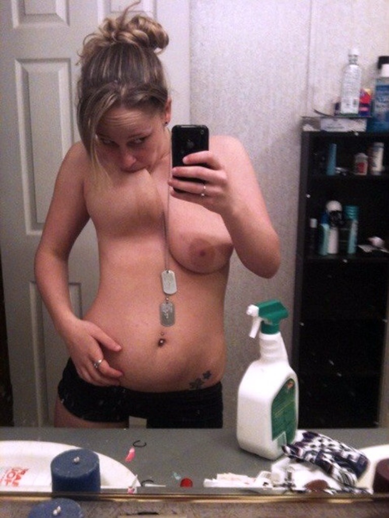 Sucking her own titty