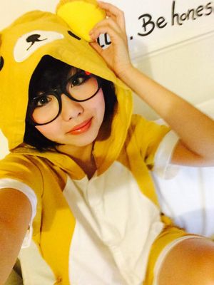Asian pikachu cosplay wearing glasses
