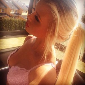 Sexy Amanda Forsberg in her bra on the balcony