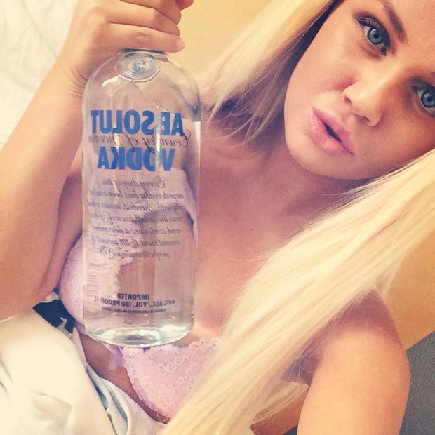 Norwegian party girl with vodka in bed