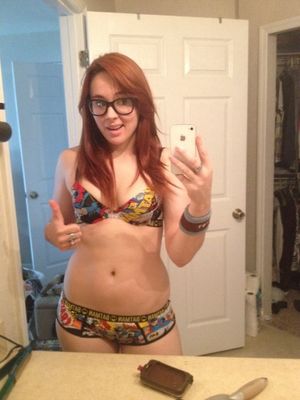 Redhead glasses girl in batman underwear