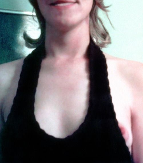Braless MILF popping her left nipple out of her halter top