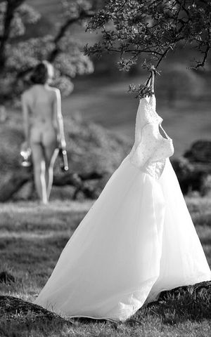 Bride walking away from her dress ready to start the honeymoon