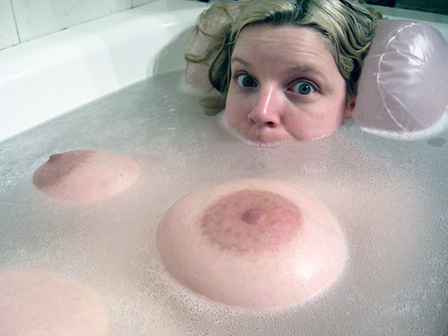 Awesome prego tits floating in the bathtub